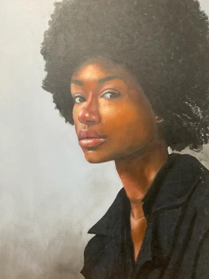 An oil painting of a woman with an afro